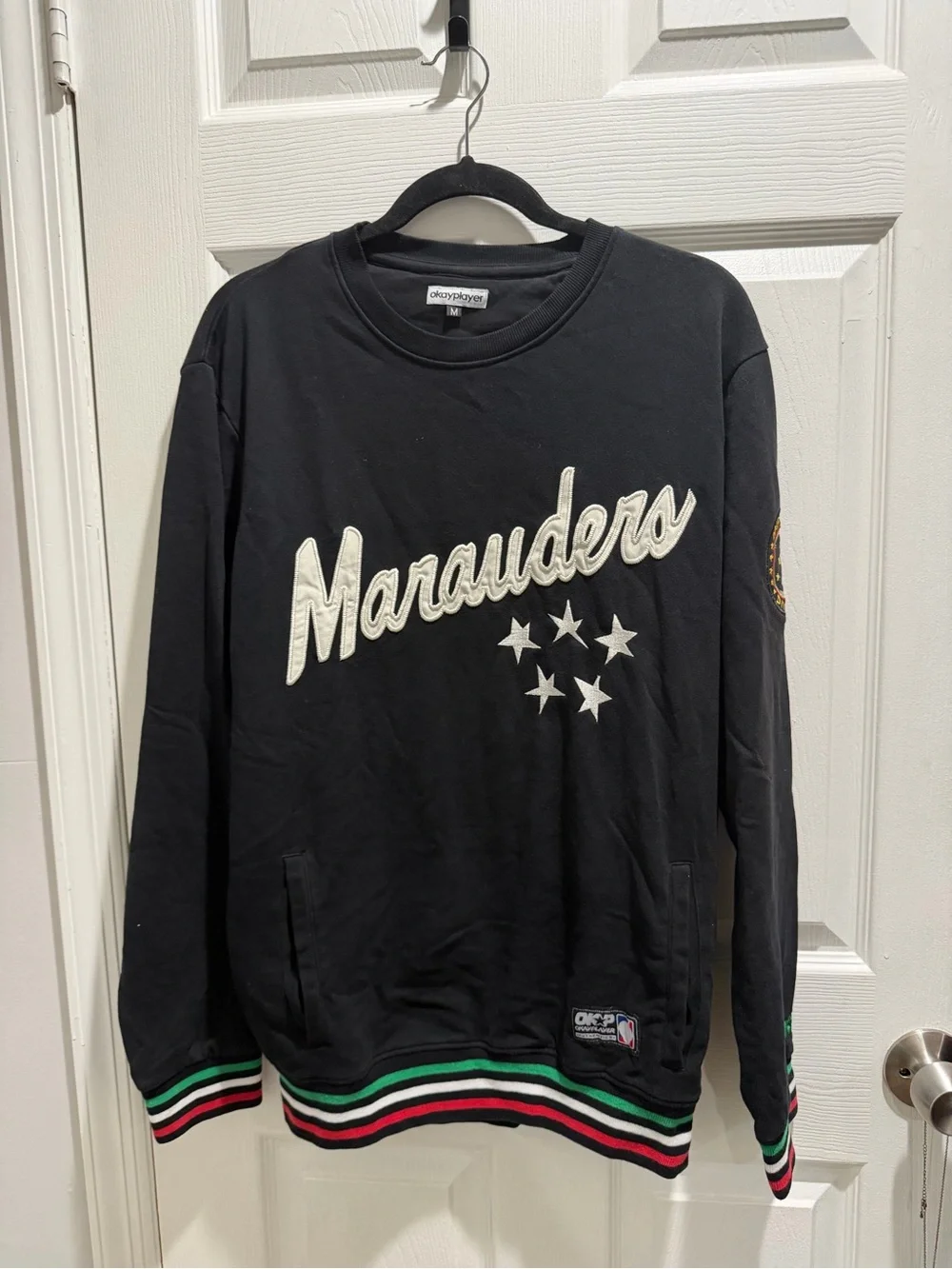 Marauders Black Crewneck Sweater with Striped Hem